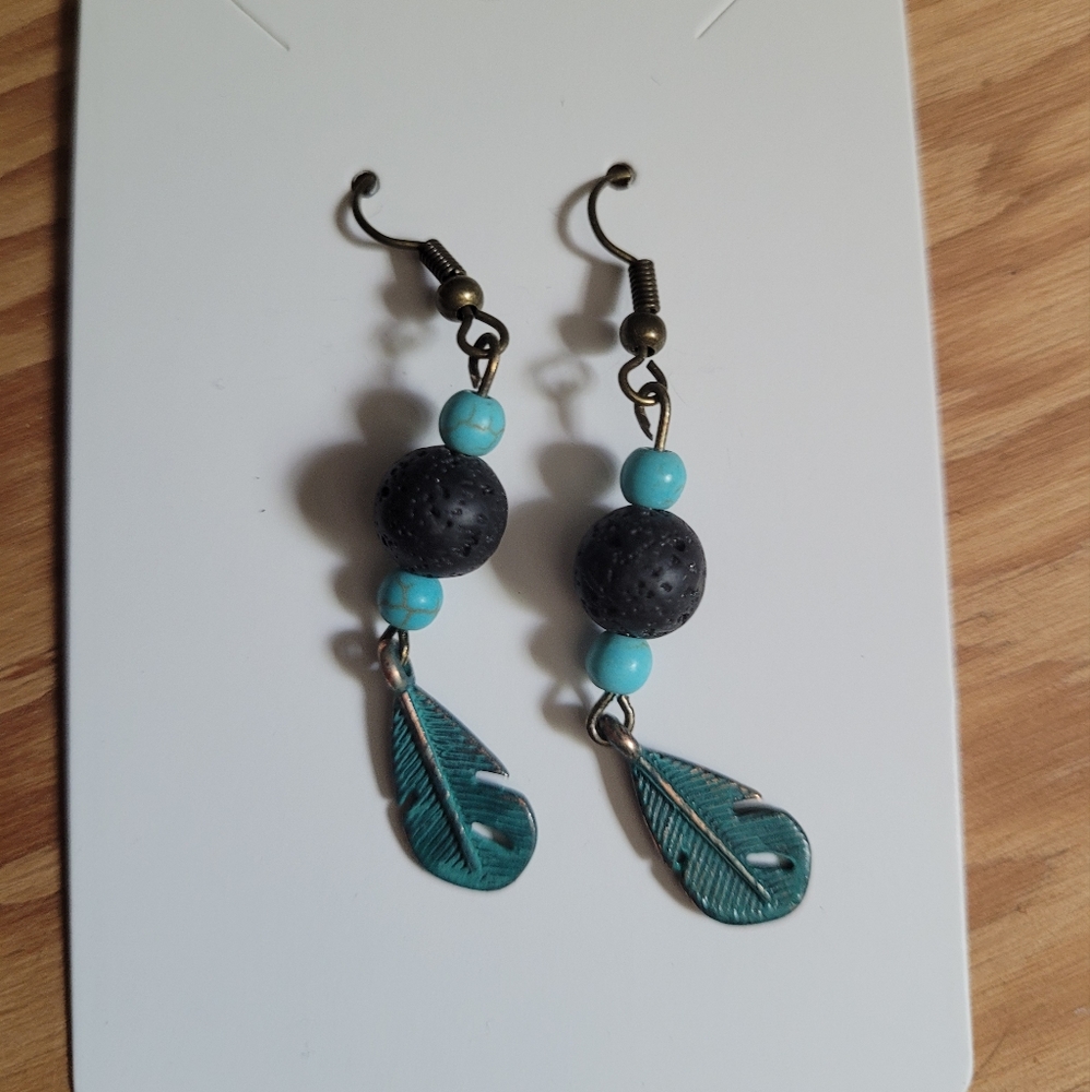 Feather charm earrings